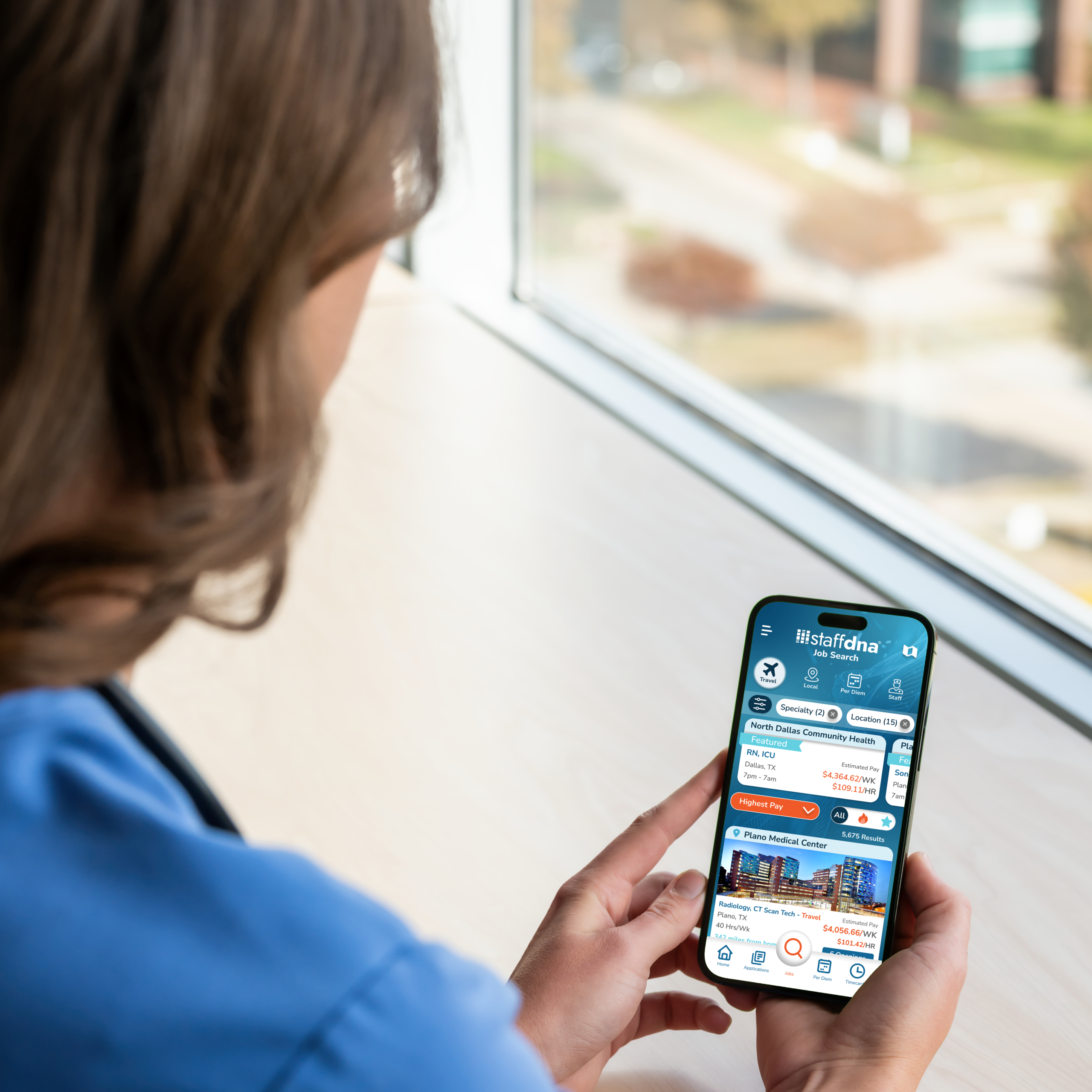 Nurse looking at jobs in the StaffDNA mobile app
