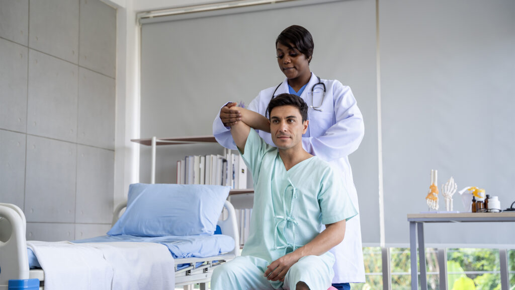 Female doctor performing a physical exam on male patient
