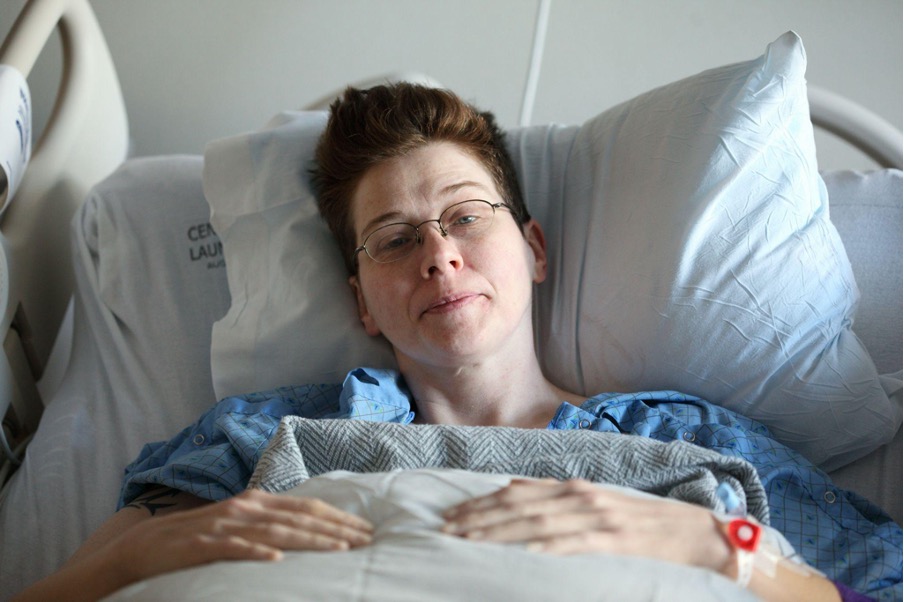 Female patient lying in hospital bed