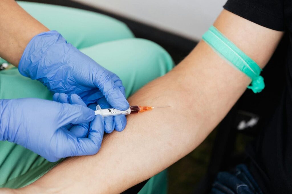Nurse administering a shot to a patient