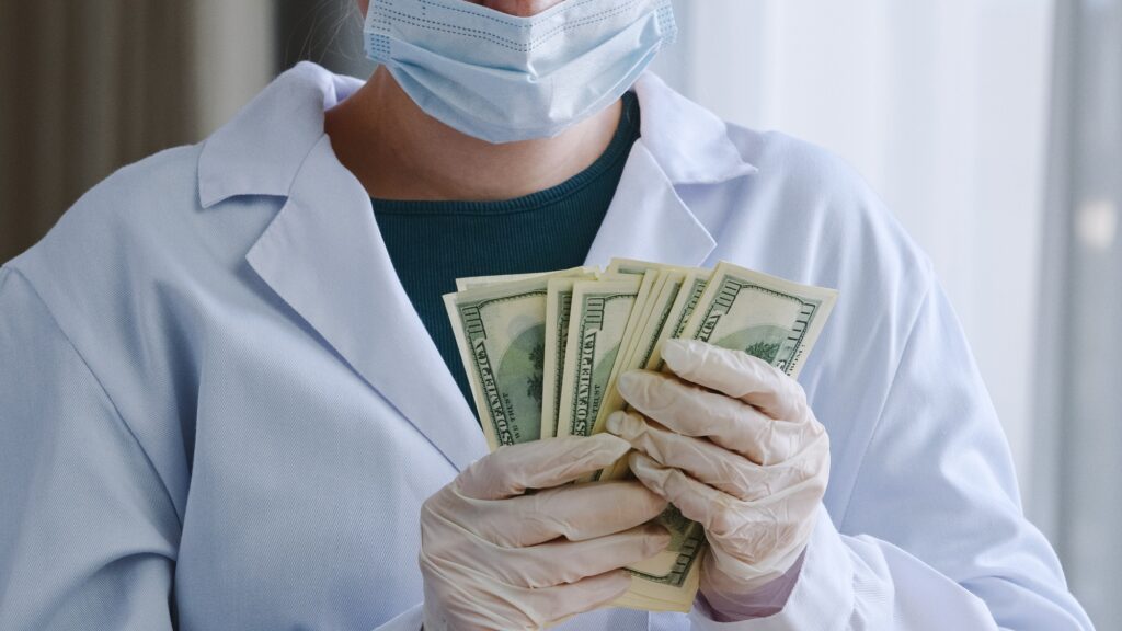 Close-up unrecognizable doctor nurse medical worker surgeon practitioner in white coat protective