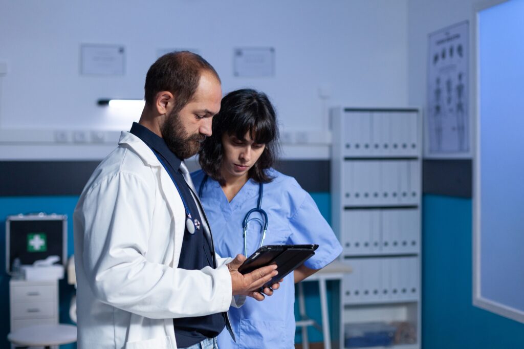 Doctor and nurse working late at night for healthcare